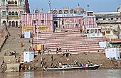 Varanasi , Kedara Ghat with the red and white-striped temple of Kedaresvara lingam